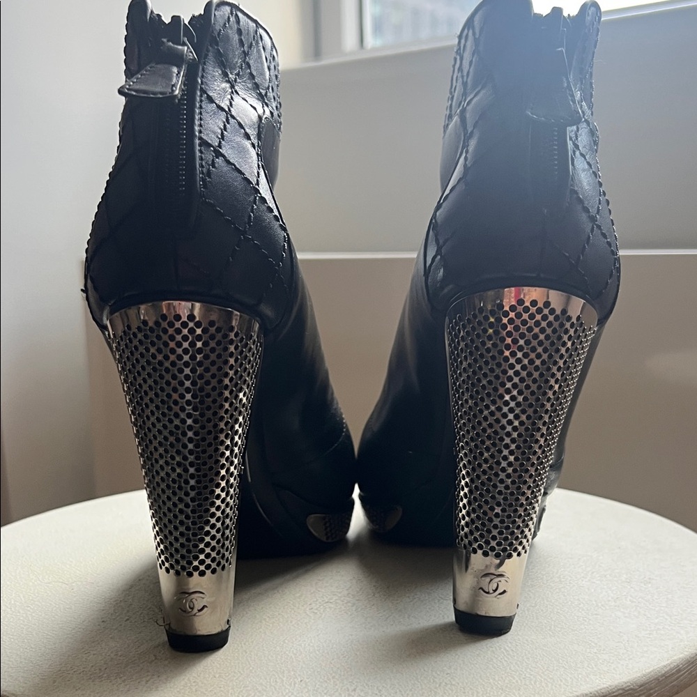 CHANEL Black Heeled Boots with Silver Accents